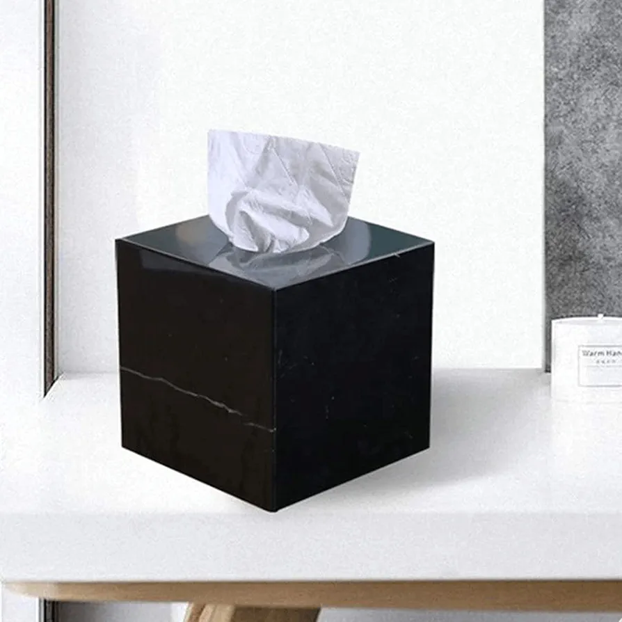 A square tissue box is a compact, cube-shaped container with an opening on top for dispensing tissues. 2