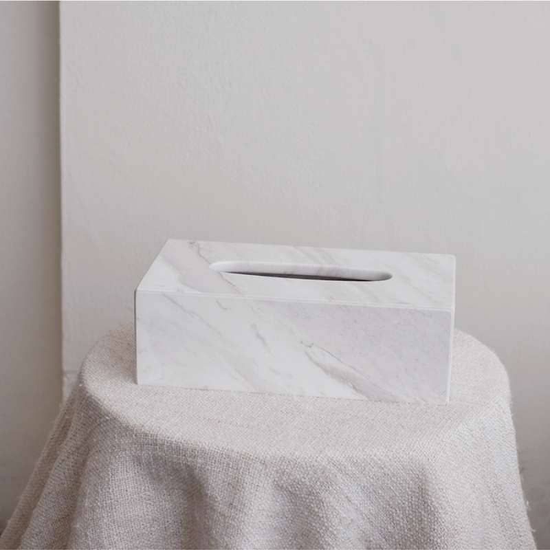 A sleek, rectangular tissue box crafted from premium marble, adding a touch of elegance to any space. Its smooth finish and natural stone pattern make it a stylish yet functional decor piece. 3