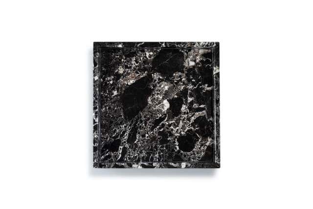 A sleek, handcrafted black marble tray featuring unique white zebra-like veining, perfect for adding a touch of elegance to any space. Ideal for serving or as a decorative accent. 2