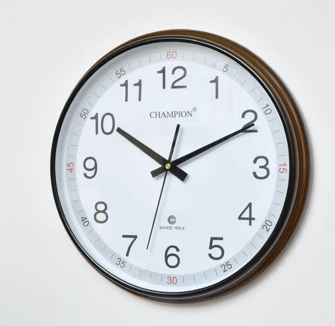 Champion wall clock 13 inches. Brown wall clock.Ticking motion