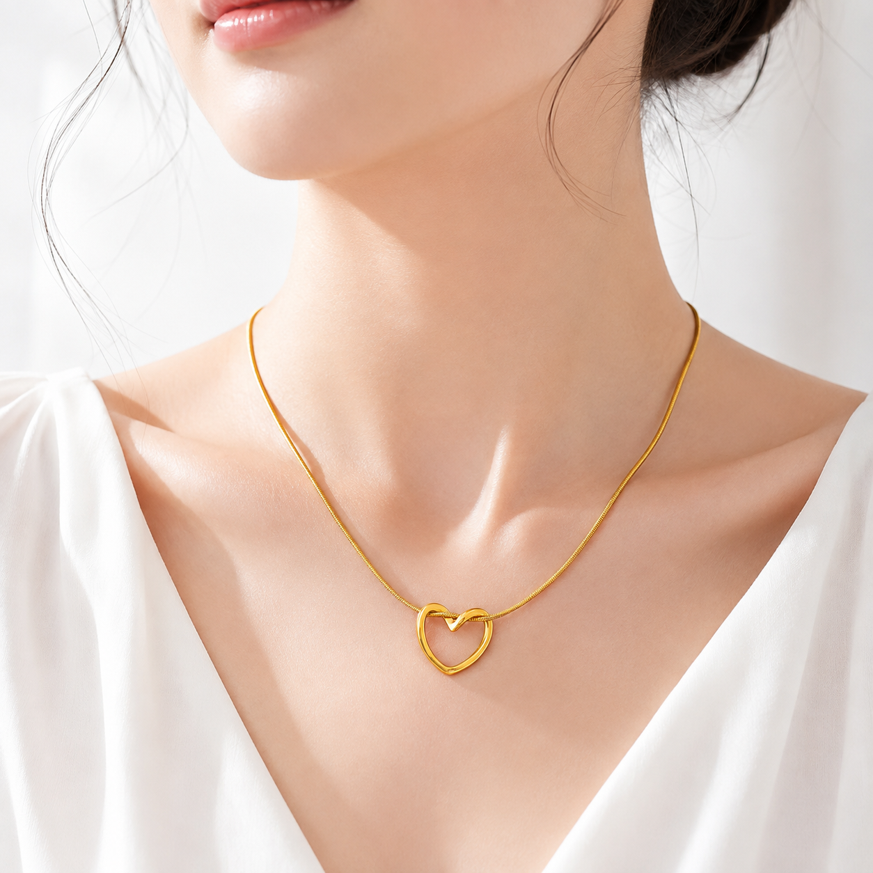 Premium gold-tone stainless steel heart pendant necklace, lightweight, hypoallergenic, tarnish-resistant, and perfect for everyday elegance.