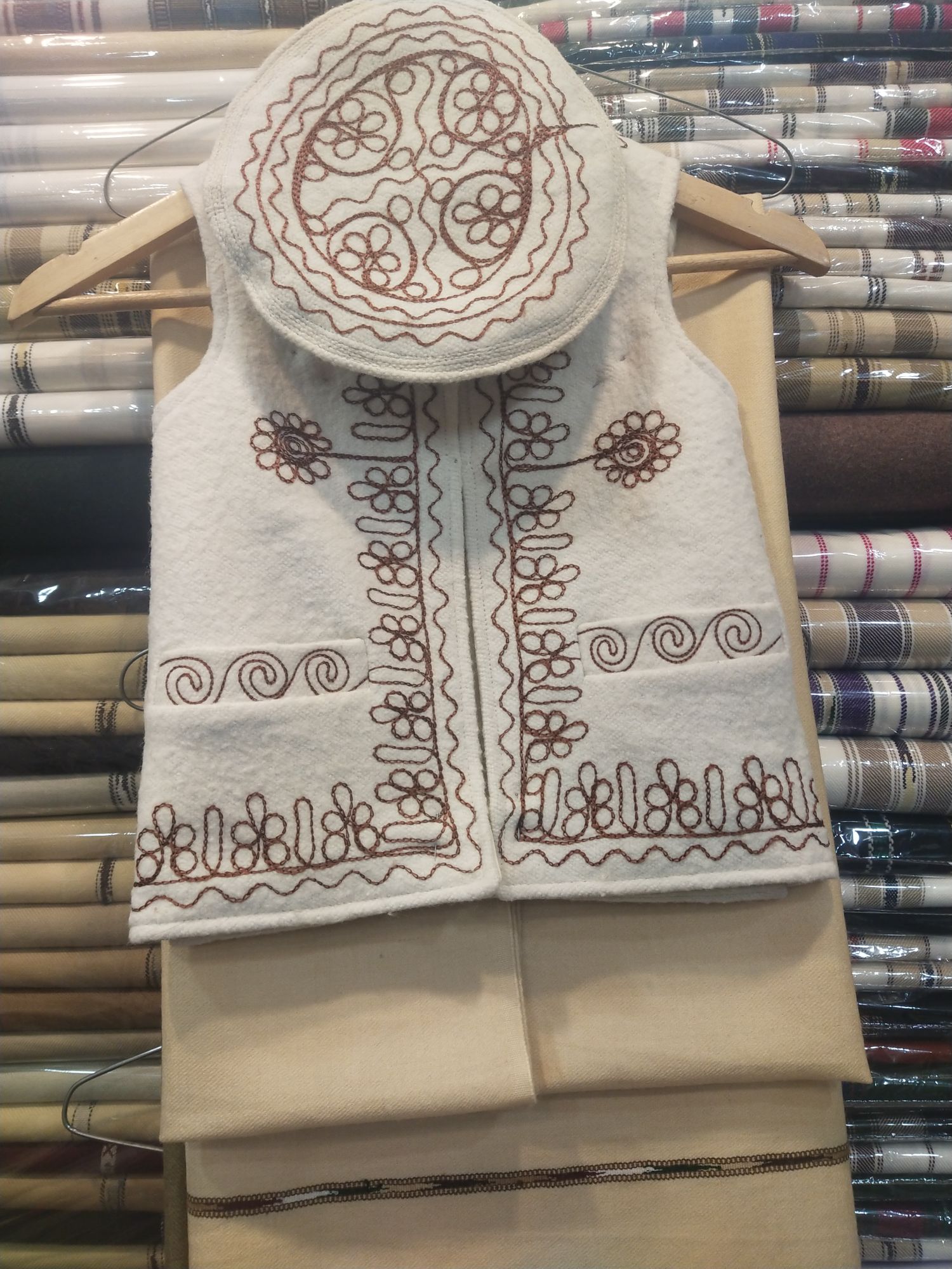 a woolen waistcoat and pakool for