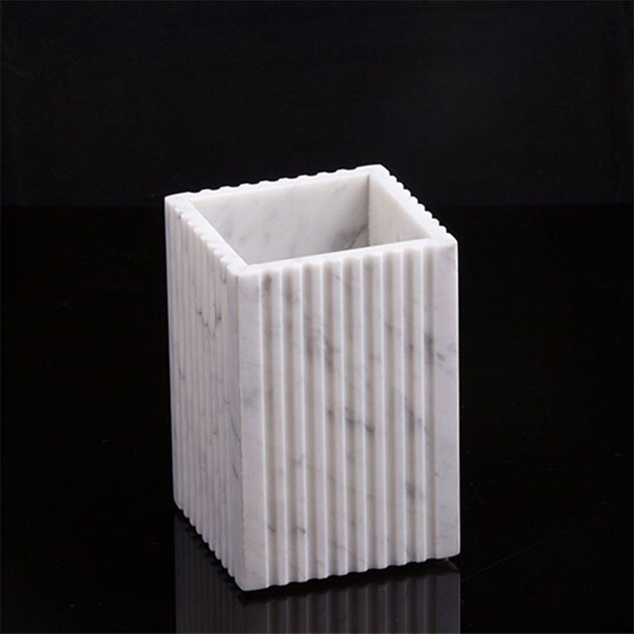 This elegant marble brush holder adds a touch of sophistication to any vanity while keeping your brushes neatly organized. Crafted from premium marble, it's both functional and stylish. 3