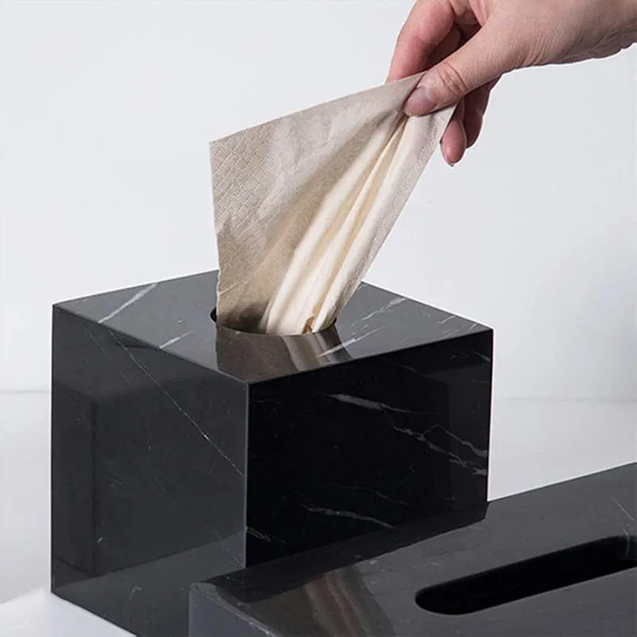 A square tissue box is a compact, cube-shaped container with an opening on top for dispensing tissues. 3