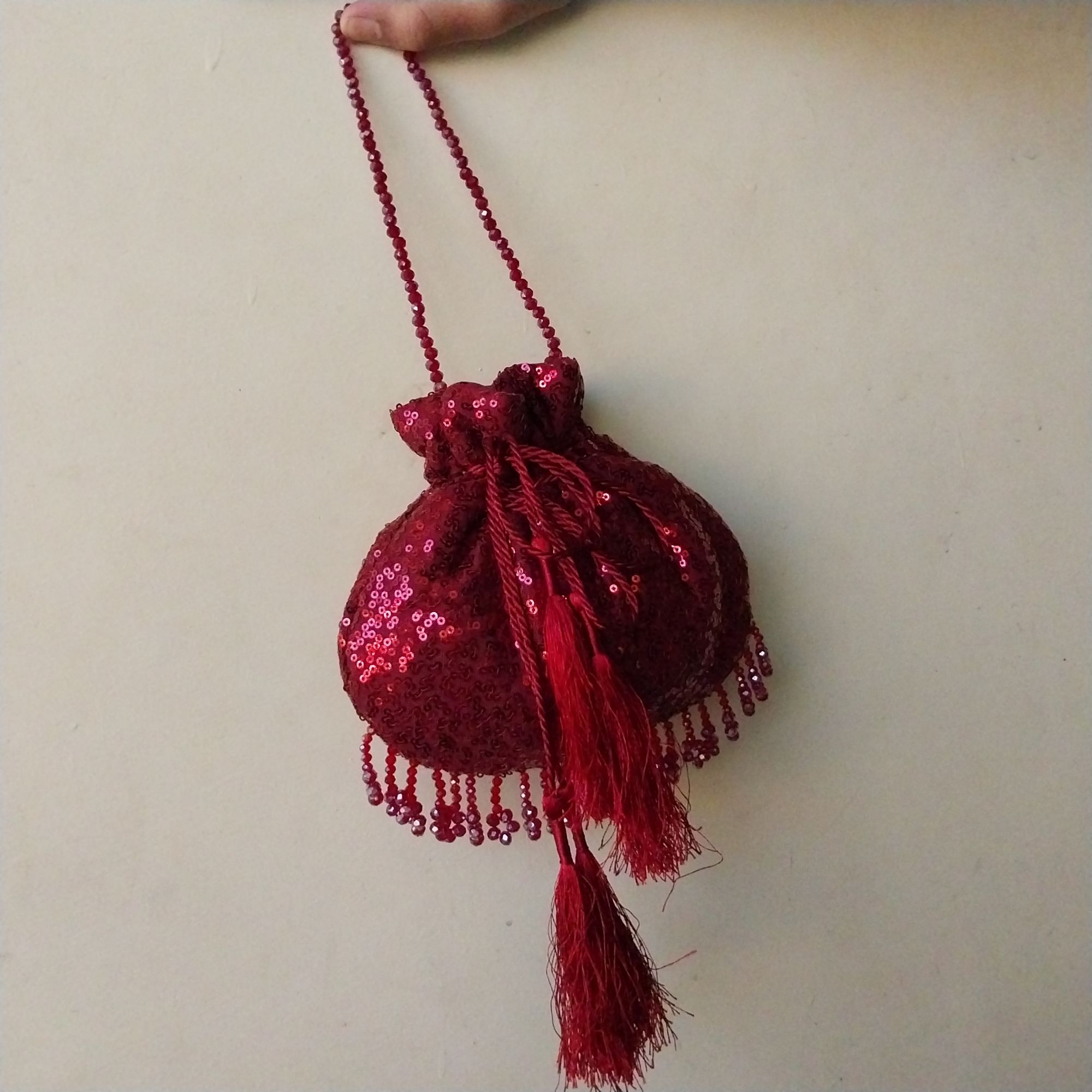 SHINY fancy potly clutch with pearl tassels
