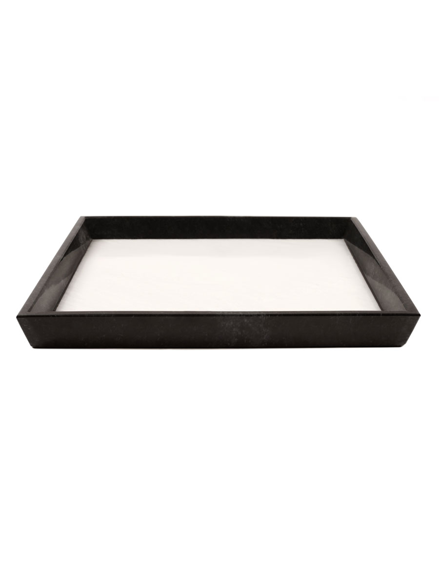 A minimalist marble tray with a pure white base and bold black border, perfect for organizing or displaying items. Its elegant contrast adds a touch of sophistication to any space.