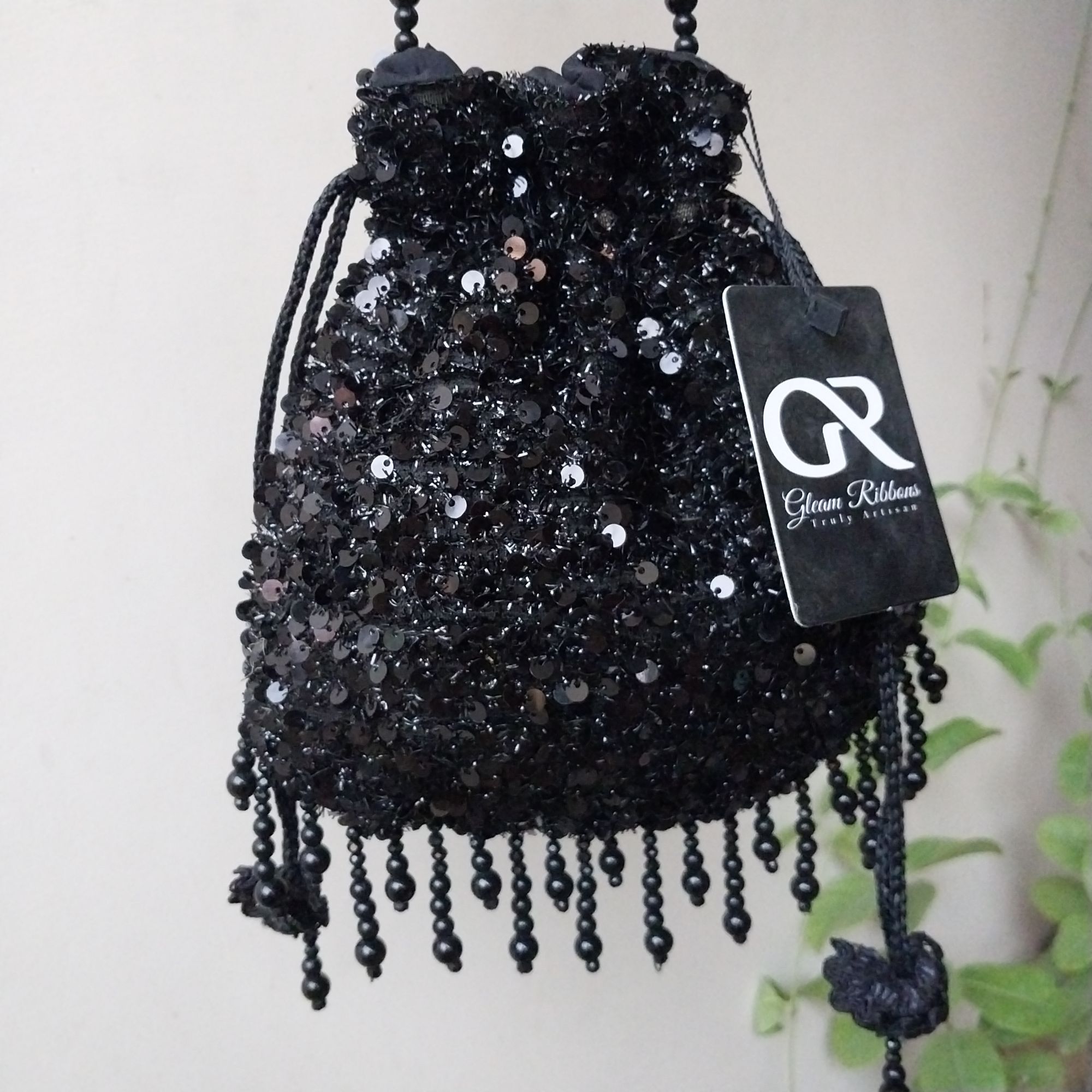 SHINY fancy potly clutch with pearl tassels