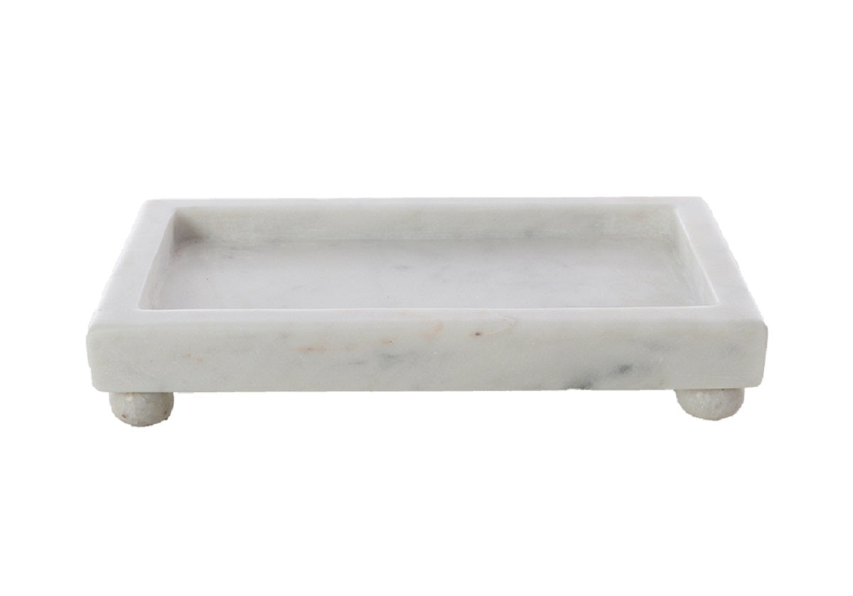 A Petite Marble Footed Tray is a chic and compact accent piece, crafted from natural marble with unique veining. 2