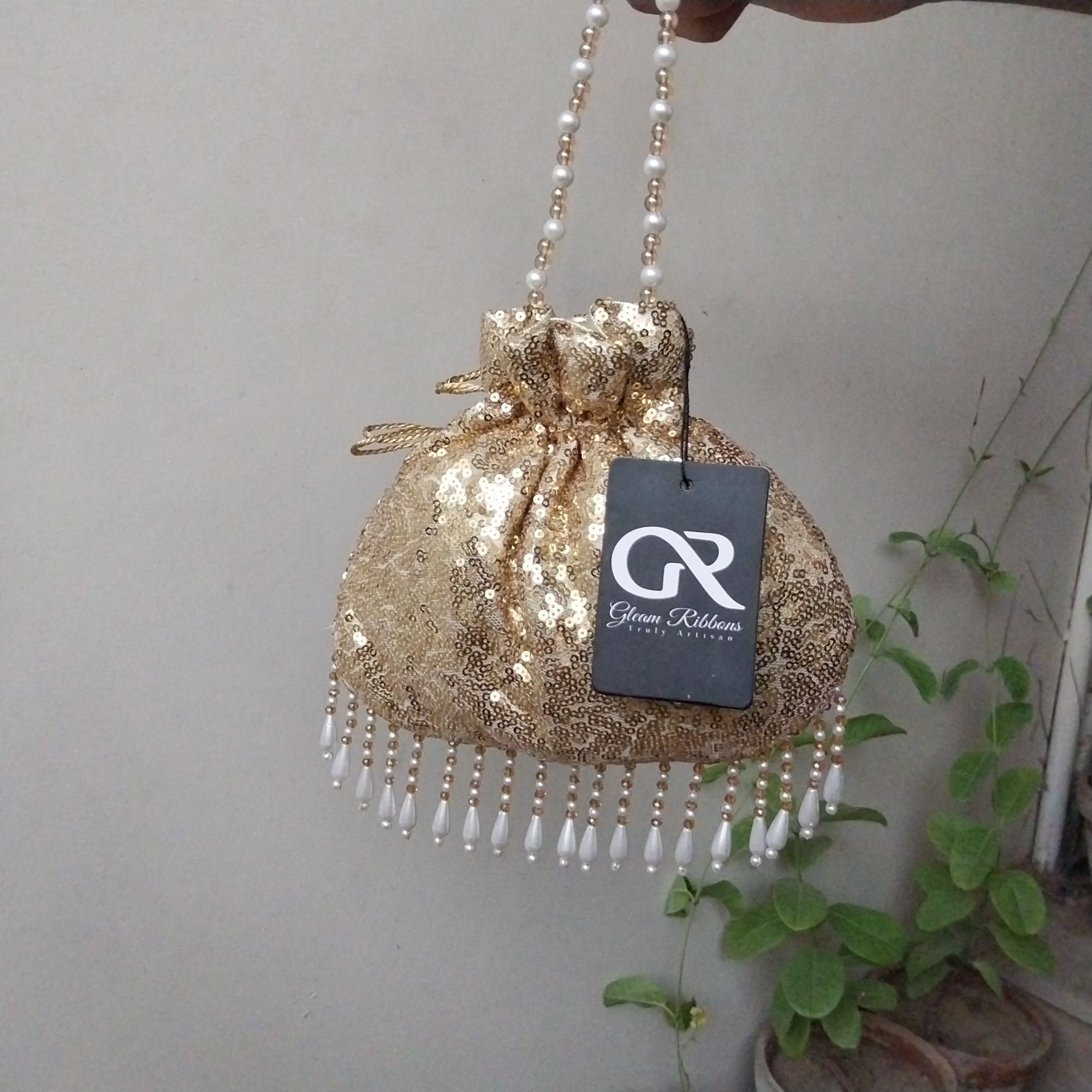 SHINY fancy potly clutch with pearl tassels