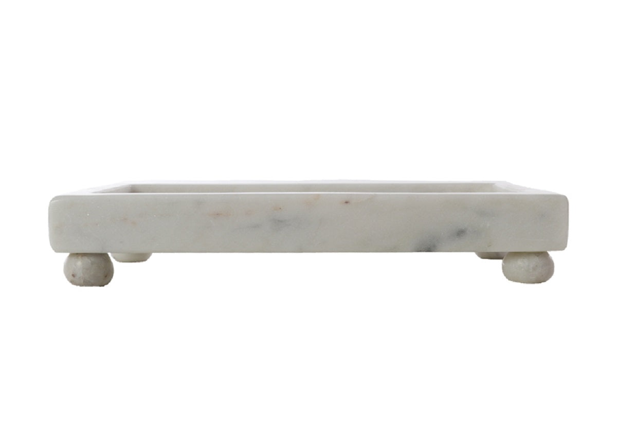 A Petite Marble Footed Tray is a chic and compact accent piece, crafted from natural marble with unique veining. 3