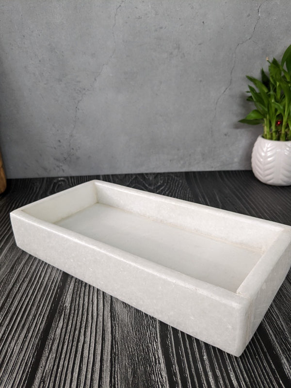 White marble is a metamorphic rock known for its fine grain and smooth, polished texture. It is often used in sculpture and architecture due to its durability and classic aesthetic appeal. 2