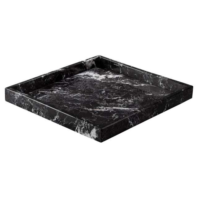 A sleek, handcrafted black marble tray featuring unique white zebra-like veining, perfect for adding a touch of elegance to any space. Ideal for serving or as a decorative accent. 3