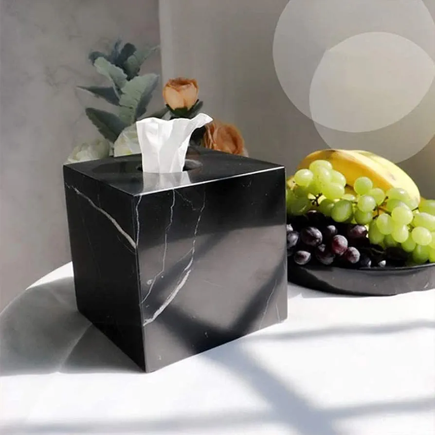 A square tissue box is a compact, cube-shaped container with an opening on top for dispensing tissues. 4