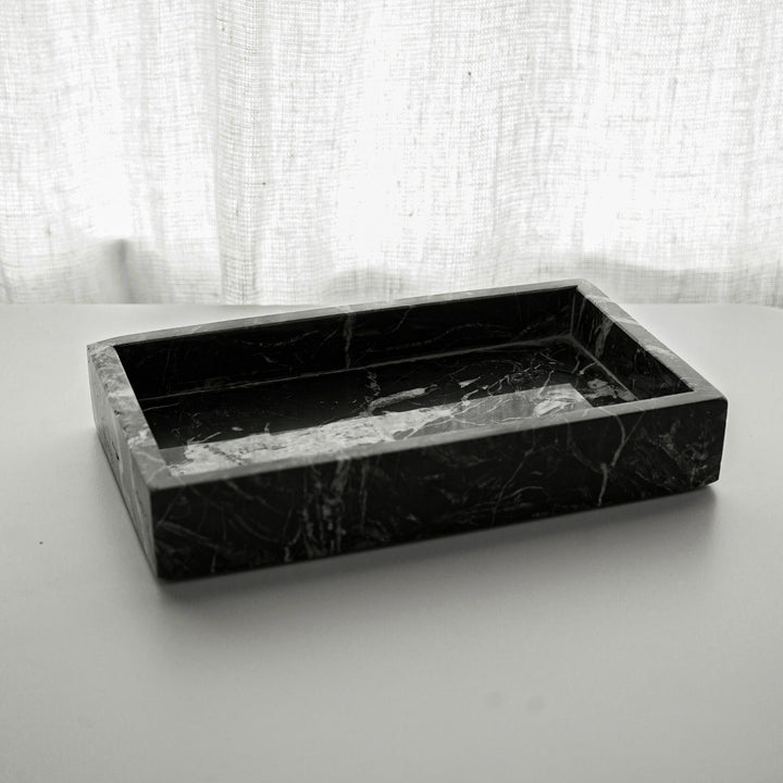 A sleek black tray with a smooth matte finish, perfect for serving or organizing items. Its minimalist design and sturdy construction make it both functional and stylish. 2
