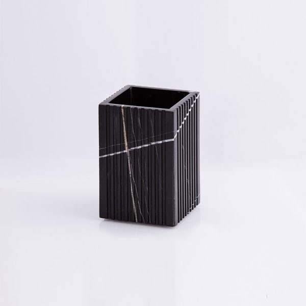 This elegant marble brush holder adds a touch of sophistication to any vanity while keeping your brushes neatly organized. Crafted from premium marble, it's both functional and stylish. 2