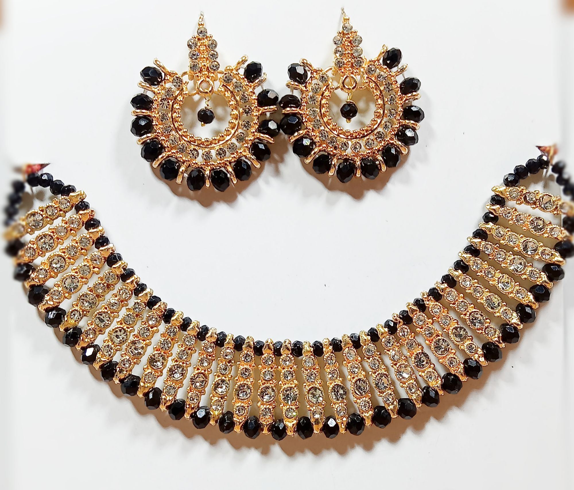 Black colour artificial jewellery set of round crystal earrings and chowker neckless high quality jewellery set in low price for women girls and bridals for weddings and Eid party low weight and heavy look